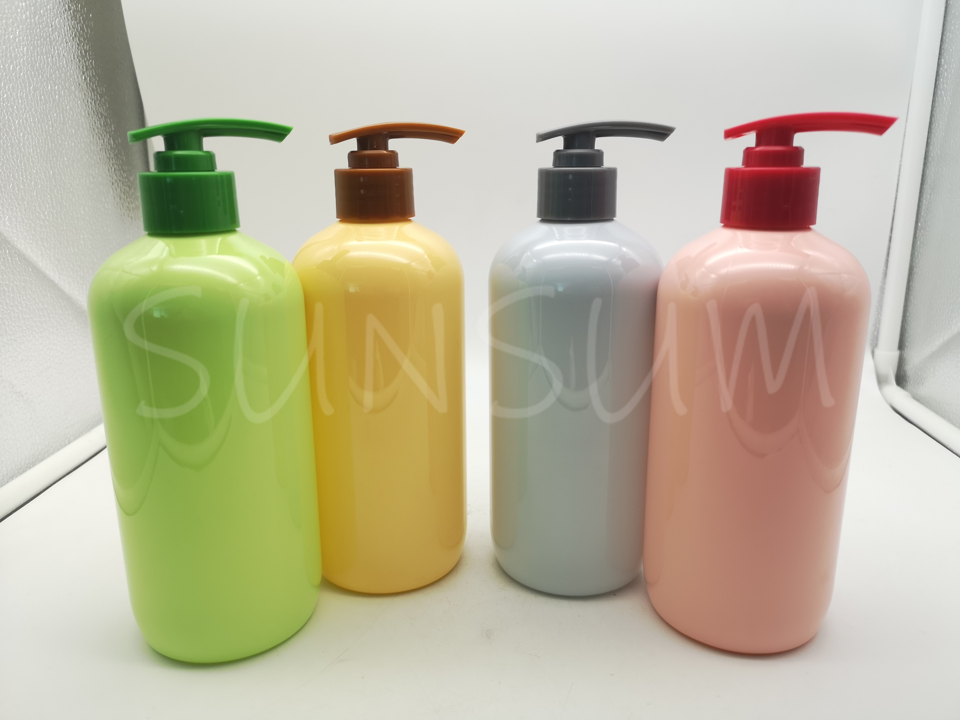 Candy colored shampoo hair care bottle