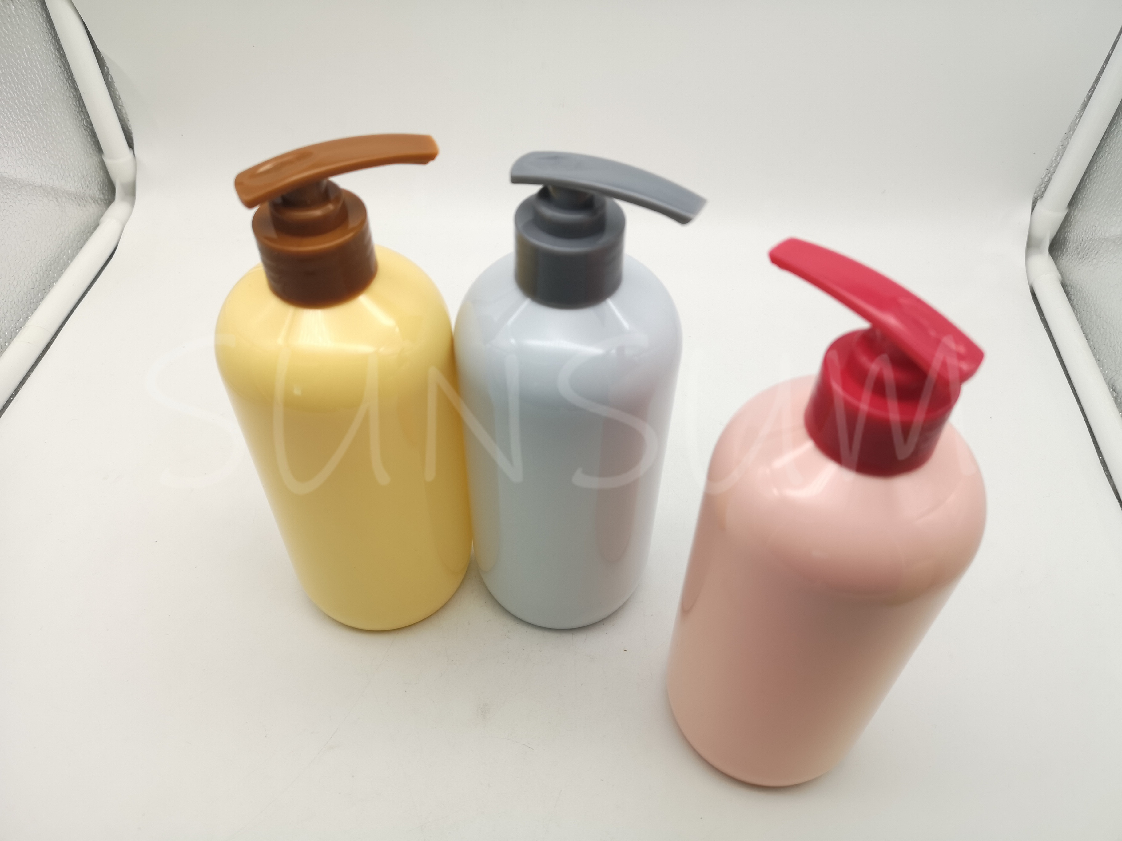 Candy colored shampoo hair care bottle