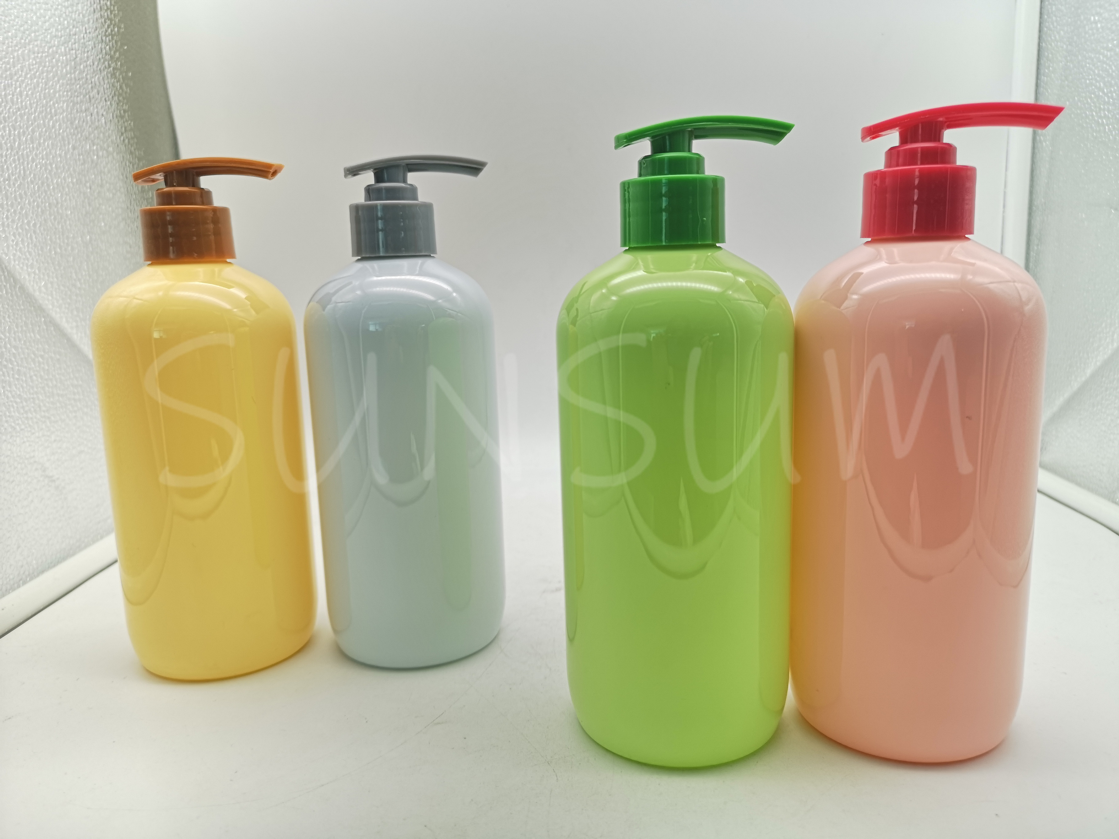 Candy colored shampoo hair care bottle